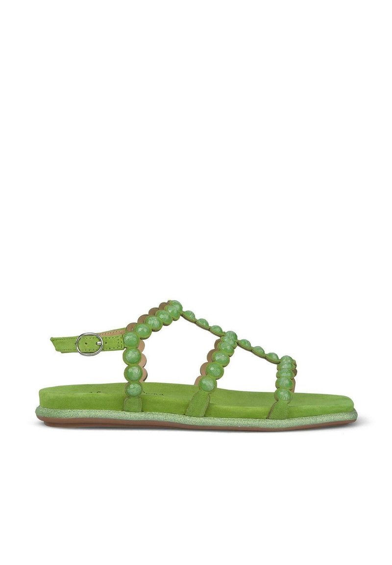 Gröna mockasandaler med pärlade detaljer, med justerbart ankelband, platt sula och cirkulärt pärlmönster längs remmarna.