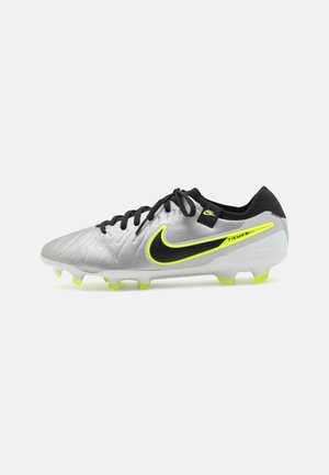 Silver and black football boots with a textured upper, neon yellow accents, a low profile, and multi-colored studs for traction.