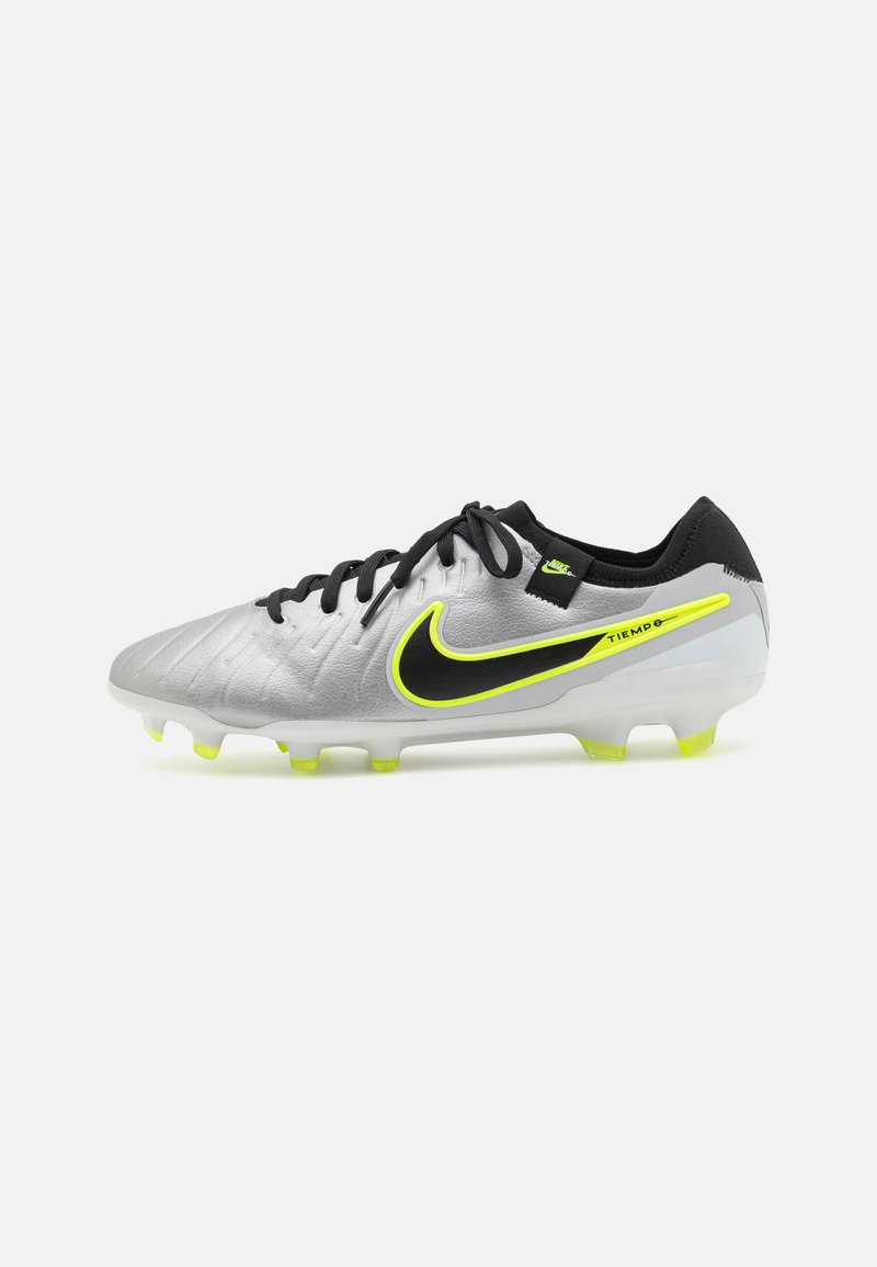 Silver and black football boots with a textured upper, neon yellow accents, a low profile, and multi-colored studs for traction.