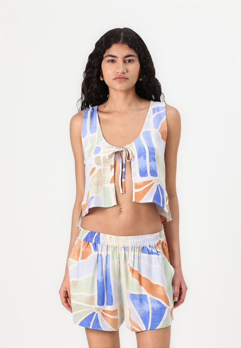 Crop top and shorts set made of lightweight fabric. Features a multicolored abstract pattern in blue, orange, and green with a drawstring waist.