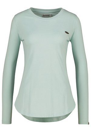 Long-sleeve T-shirt in mint green, round neck, and smooth texture. Features a subtle logo accent on the chest and a curved hemline.