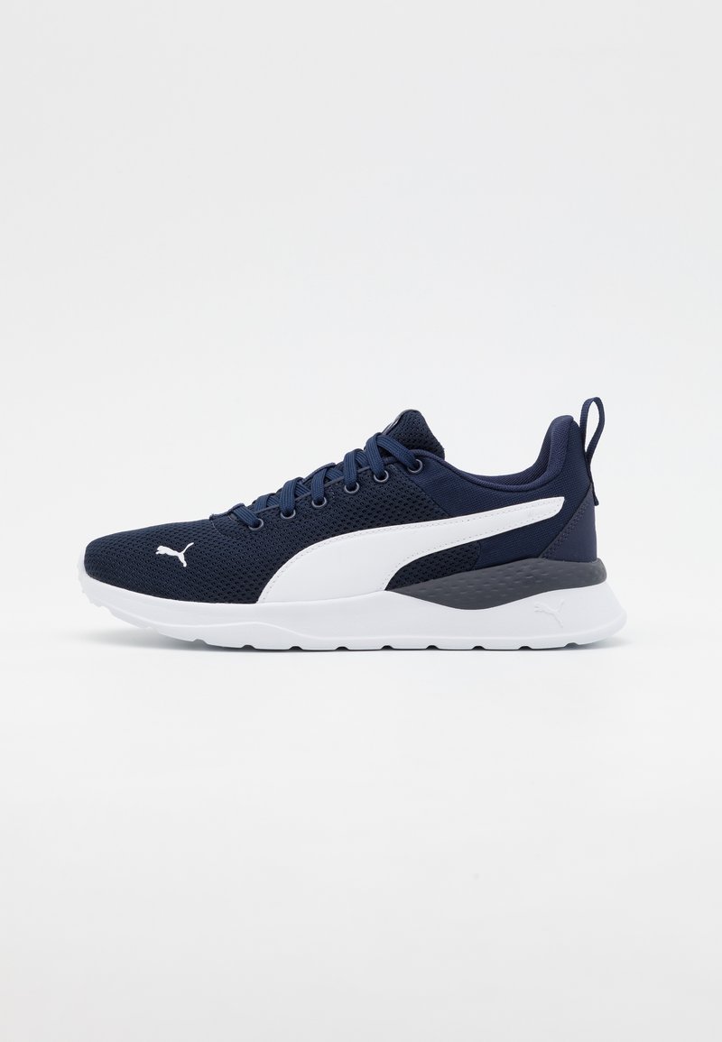 Navy mesh athletic shoes with white accents, a textured midsole, and flat rubber outsole; features laces and a pull tab at the heel.