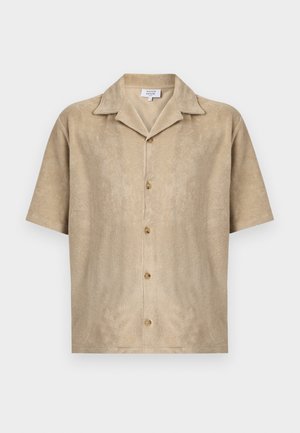 Beige short-sleeve shirt with spread collar, four buttons down front, and soft textured fabric by Maison Kitsuné.