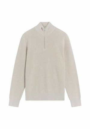 Ljust beige, ribbat stickad tröja med halvdragkedja i kragen. Långa ärmar, minimalistisk design, mjuk textur, idealisk för att lagra under kyligare väder.