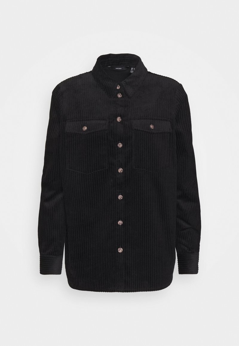 Chemise en velours côtelé noire à manches longues, avec un devant boutonné, deux poches poitrine et un col classique. Texture côtelée et boutons de couleur cuivrée.