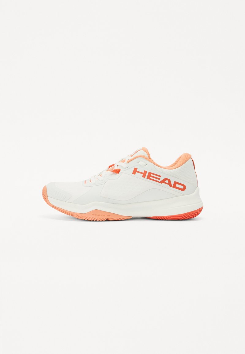White athletic shoe with orange accents, mesh upper, lace closure, and textured rubber sole featuring zigzag grip pattern. Brand logo visible.