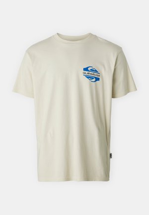 Light cream cotton t-shirt with a round neckline. Features a blue Quiksilver logo on the upper left chest area. Short sleeves.