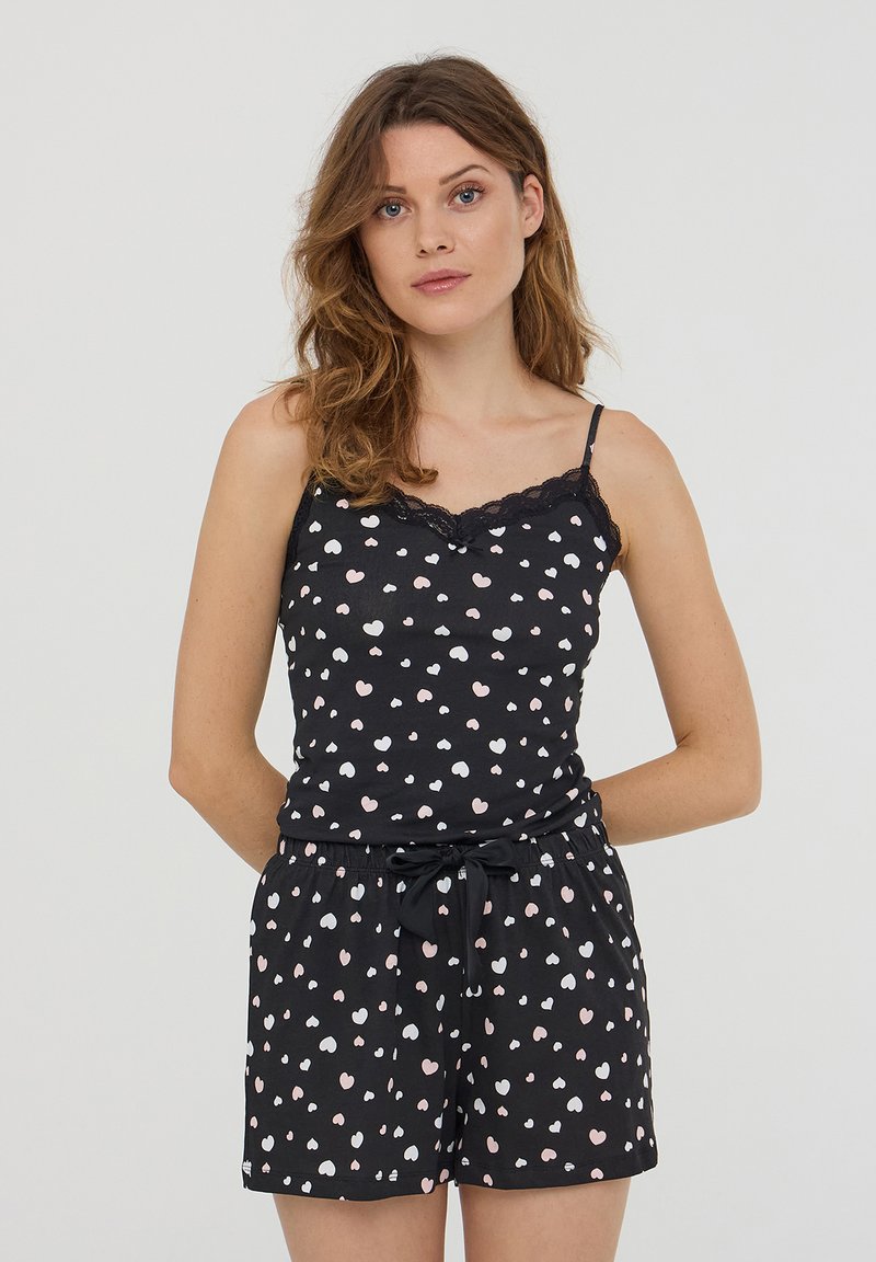 Set da notte nero composto da un top senza maniche e pantaloni corti, decorato con un motivo a cuori multicolore e bordo in pizzo sul top.