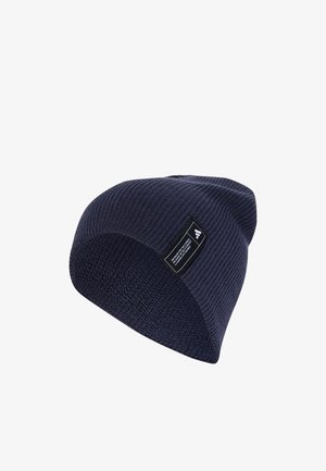 Knit beanie in dark navy, featuring a textured ribbed design and a black label with white text and logo.