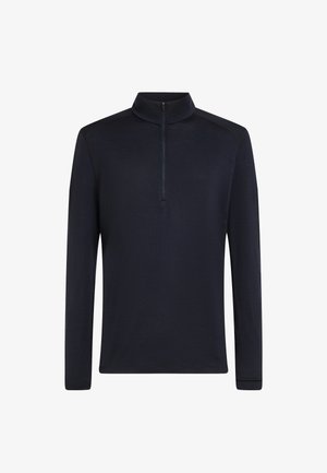 Tumman sininen neljännes-vetoketjullinen pullover, joka on valmistettu sileästä, kevyestä kankaasta. Varustettu pystykolarilla ja pitkillä hihoilla, jossa on minimaalinen muotoilu.