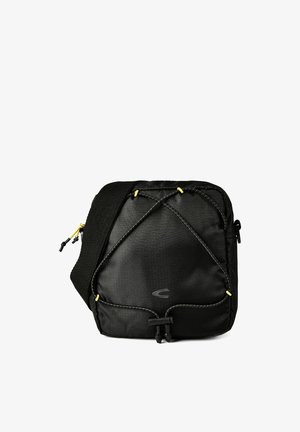 Sac bandoulière carré noir avec sangle réglable, cordon élastique à l'avant et fermeture éclair.