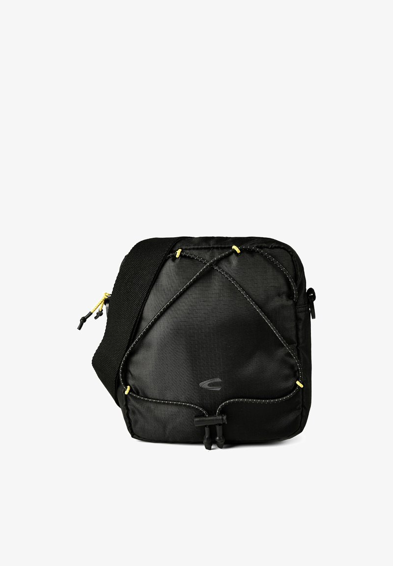 Sac bandoulière carré noir avec sangle réglable, cordon élastique à l'avant et fermeture éclair.