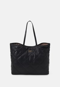 Czarna pikowana torba typu tote wykonana ze skóry ekologicznej. Posiada dwa solidne paski na ramię oraz wnętrze wyściełane materiałem w panterkę. Z przodu złote logo.