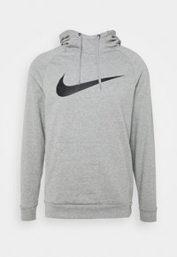 Grijze hoodie met een zwart Nike swoosh logo, een trekkoordcapuchon en een voorzak. Gemaakt van zachte stof met een relaxte pasvorm.