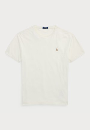 T-shirt en coton blanc avec un col rond, des manches courtes et un petit logo brodé sur la poitrine gauche. Texture douce, coupe décontractée.