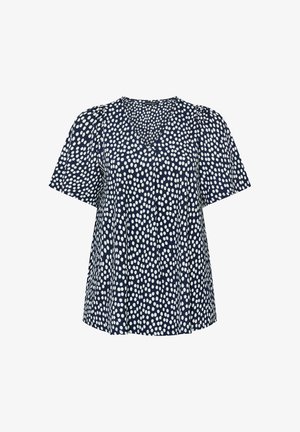 Marineblaue kurzärmlige Bluse mit weißen, unregelmäßigen Polka-Dots und einem V-Ausschnitt, lockere Passform.