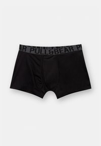 Zwarte boxer shorts met een grijze tailleband waarop de merknaam "PULL&BEAR" in vette letters staat. Gemaakt van zacht, rekbaar materiaal.