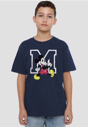 Navy blue cotton t-shirt featuring a large white letter "M" with a graphic of Mickey Mouse in red shorts and yellow shoes. Short sleeves.