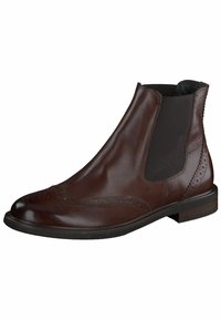 Botín Chelsea de cuero marrón con paneles laterales elásticos, detalles de brogue en la punta y suela de goma plana. Textura suave y diseño elegante.