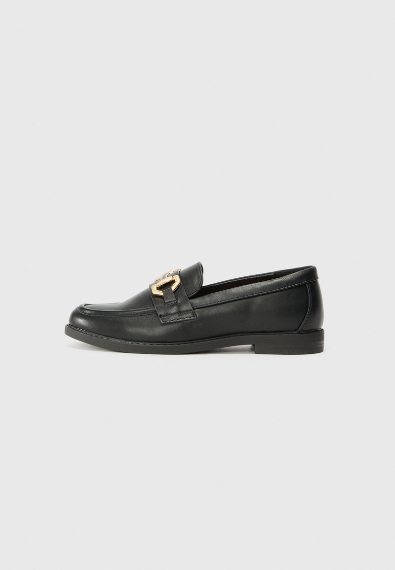 Black leather loafer with a round toe, featuring a gold-tone buckle accent and a low heel, smooth texture, and minimal stitching detail.