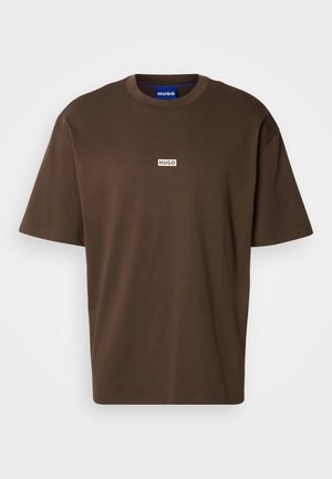Brown cotton T-shirt with short sleeves and a crew neck. Features a small white rectangular logo with "HUGO" on the front.