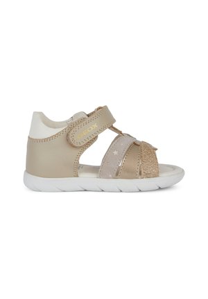 Sandali beige con tomaia in tessuto e pelle, cinturino regolabile, dettagli luccicanti, design open toe e suola in gomma bianca.