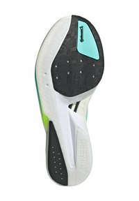 Shoe sole with a black textured rubber base, green accents, white midsole, and a blue accent square, featuring perforations for grip.