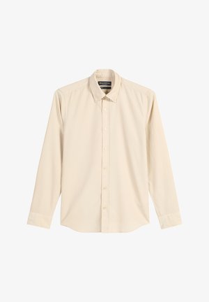 Beige Langarmhemd aus Baumwolle mit einem Button-down-Kragen, Vorderknöpfen und abgerundetem Saum. Glatte Textur, lässiges Design.