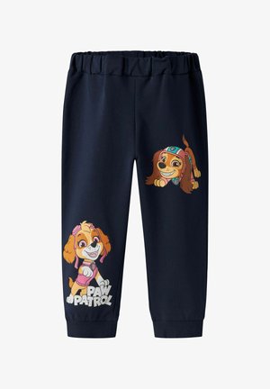 Pantalones deportivos azul marino con una cintura elástica, que presentan dos perros de dibujos animados con colores vibrantes y parches, texto "PAW PATROL" en blanco.