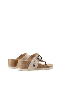 Sandali con zeppa in tessuto crema testurizzato e suola in sughero glitterato. Presentano una fibbia nera regolabile e una soletta imbottita per il massimo comfort.