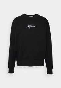 Sweat-shirt noir en tissu doux, avec un col rond et des poignets côtelés. Logo brodé blanc "Moschino" sur le devant.