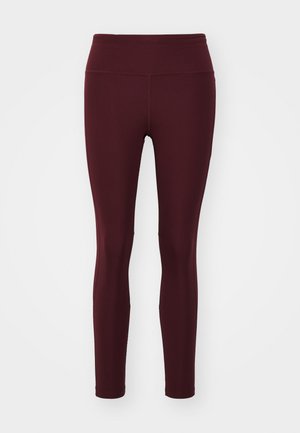 Maroon leggings made of stretch fabric with a high waistband, featuring a smooth texture and fitted silhouette, without patterns or accents.