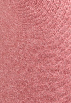 Tela de color rosa claro con un patrón texturizado de punto. La superficie parece suave y ligeramente difusa, con un color uniforme en todo su alrededor.