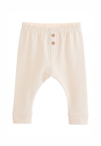 Cream-colored baby pants with elastic waistband and two small wooden buttons at the front center.