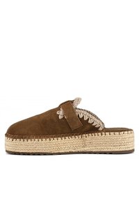 Brown suede clog with a braided jute sole, featuring a decorative strap and stitched accents along the edges, offering a textured finish.