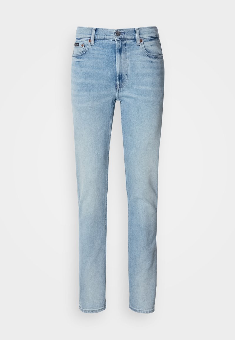 Light blue, straight-leg jeans made of denim with a faded finish. Features five pockets, a zip fly, and a branded waistband label.