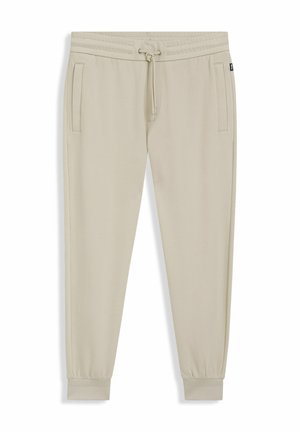 Pantaloni jogger beige con vita elastica, coulisse, tasche laterali e polsini elastici alle caviglie.