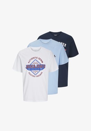 Three cotton T-shirts: one white with a graphic logo, one light blue, and one navy blue. All have short sleeves and crew necklines.