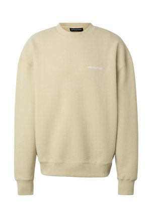 Sweat-shirt beige côtelé à manches longues avec col rond, petit logo blanc "PEGADOR" sur le côté gauche de la poitrine.