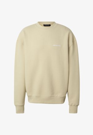 Bézs színű, bordázott hosszú ujjú, kerek nyakú pulóver, bal mellrészen kis fehér "PEGADOR" logóval.