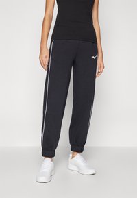 Mizuno ATHLETICS PANT - Treniņtērpa apakšdaļas - black