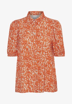 Oranžs ziedu raksts pogu krekls ar apkakli, īsām pūkainām piedurknēm un brīvu piegriezumu. Izgatavots no viegla auduma.