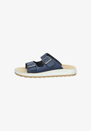 Navy blue slide sandal with two adjustable buckled straps, beige cushioned footbed, white midsole, and tan rubber outsole.