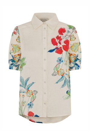 Lühikeste varrukatega linane särk, millel on kreemikas alus ja erksad lillemustrid punases, sinises ja kollases värvitoonis. Esiküljel nööbid, alumine serv kõverdatud.