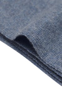 Tessuto di lana blu con una tessitura texture, mostrante un bordo liscio e fibre morbide. Il materiale appare caldo e accogliente.