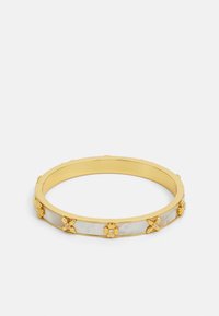 Gold-tone bangle bracelet featuring a glossy white inlay and floral accents with clear gemstone centers. Smooth, rounded design.