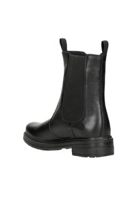 Bottines en cuir noir avec panneaux élastiques sur les côtés, semelle en caoutchouc plate, bout arrondi et languettes pour un enfilage facile. Fini lisse et détails subtils.