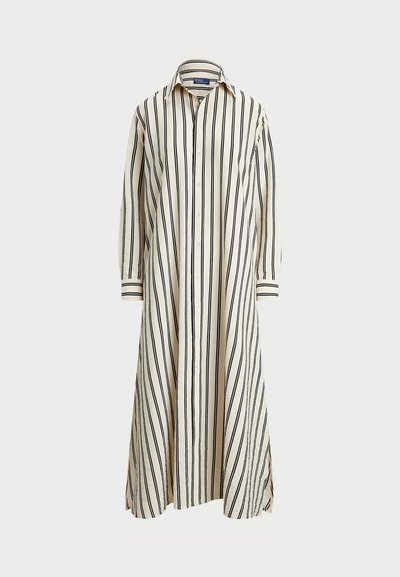 Randig skjortklänning i kräm och svart. Har knäppning fram, krage, långa ärmar, sidofickor och en avslappnad passform. Tillverkad av bomull.