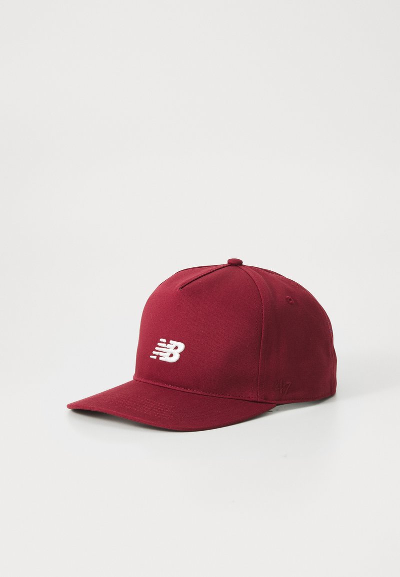 Maroon baseball cap made of fabric with a structured design. Features a white logo and stitching details on the front and side.