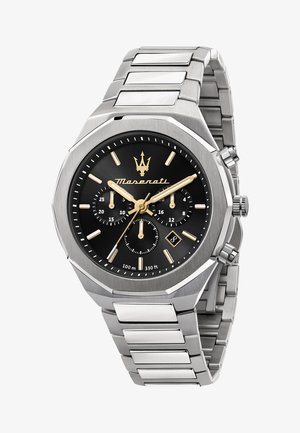 Montre en acier inoxydable argenté avec boîtier octogonal, cadran noir, accents dorés, sous-cadrans chronographe et affichage de la date. Résistante à l'eau jusqu'à 100 m.